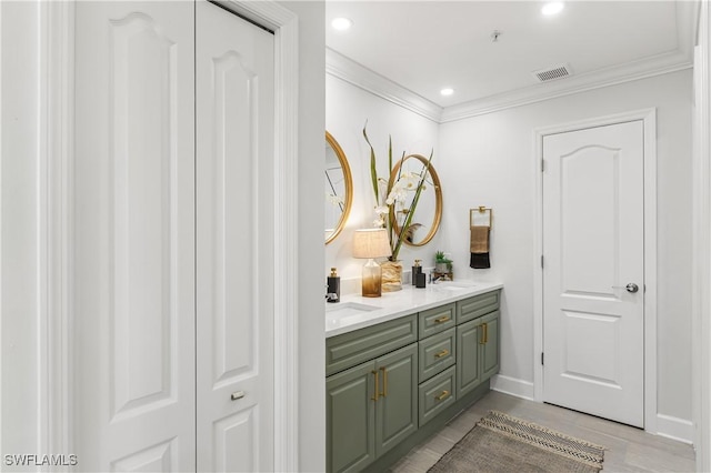 full bath with recessed lighting, a sink, visible vents, double vanity, and crown molding