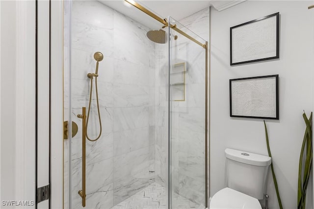 full bathroom with toilet and a marble finish shower