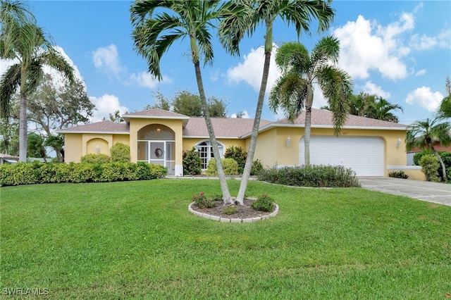 view of front of home featuring a garage, driveway, a front lawn, and stucco siding