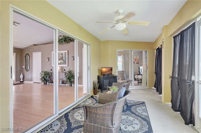 sunroom with visible vents and ceiling fan