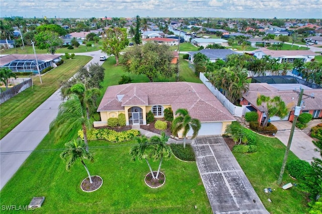 birds eye view of property with a residential view