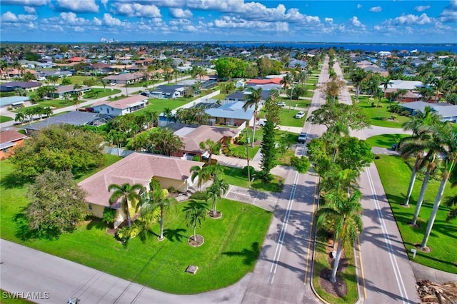 birds eye view of property with a residential view