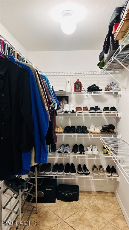 spacious closet with tile patterned flooring