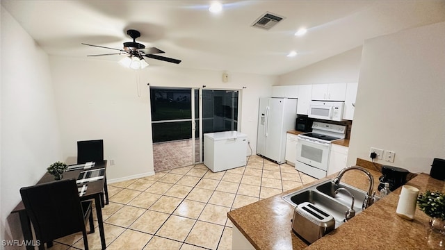 kitchen with white appliances, visible vents, light tile patterned flooring, a sink, and white cabinetry