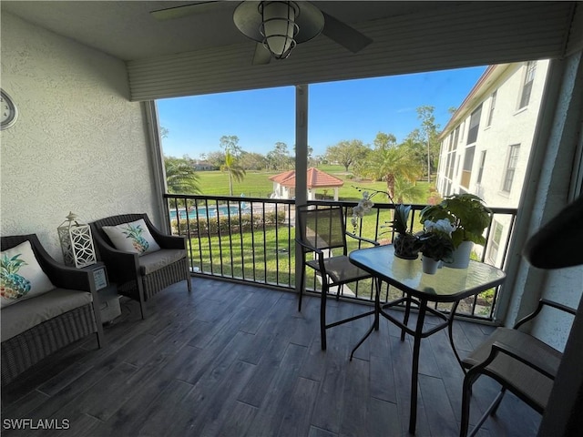 balcony featuring a ceiling fan