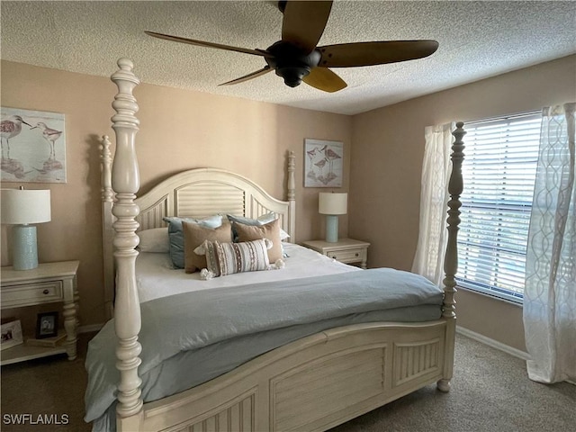 bedroom with a textured ceiling, ceiling fan, carpet, and baseboards