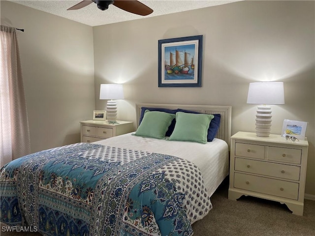 bedroom featuring a ceiling fan, carpet flooring, and a textured ceiling