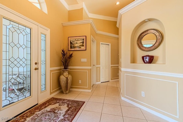 2109 Morning Sun Ln, Naples, FL 34119 - entryway featuring a wainscoted wall, a decorative wall, ornamental molding, recessed lighting, and light tile patterned floors