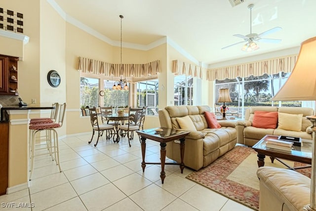 2109 Morning Sun Ln, Naples, FL 34119 - living room with visible vents, ceiling fan, crown molding, and light tile patterned floors