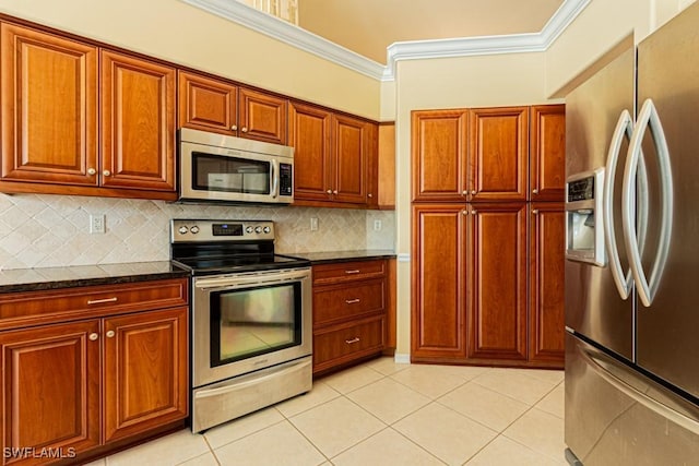 2109 Morning Sun Ln, Naples, FL 34119 - kitchen featuring light tile patterned flooring, crown molding, decorative backsplash, and stainless steel appliances