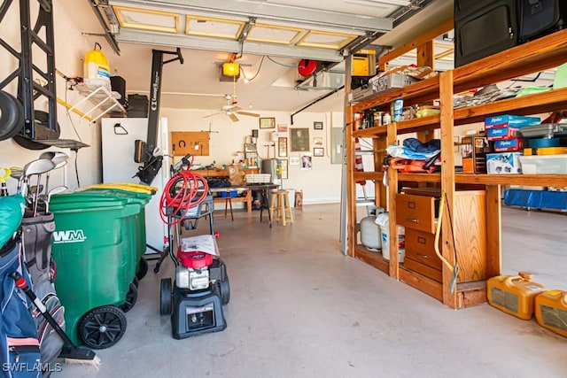 2109 Morning Sun Ln, Naples, FL 34119 - garage with ceiling fan, a garage door opener, and a workshop area