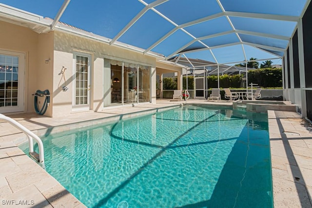 2109 Morning Sun Ln, Naples, FL 34119 - view of pool with a pool with connected hot tub, glass enclosure, and a patio area