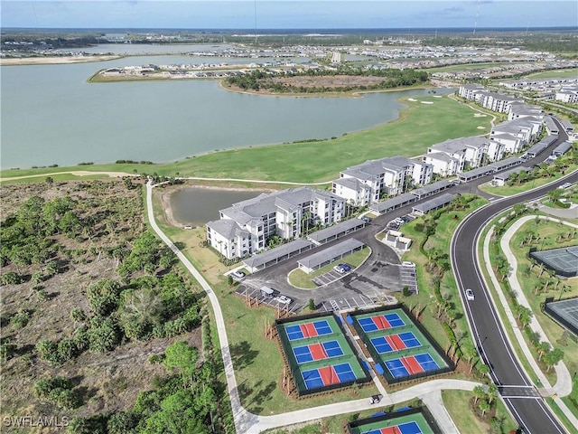 birds eye view of property with a water view