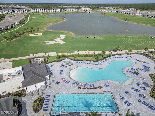 bird's eye view with view of golf course and a water view