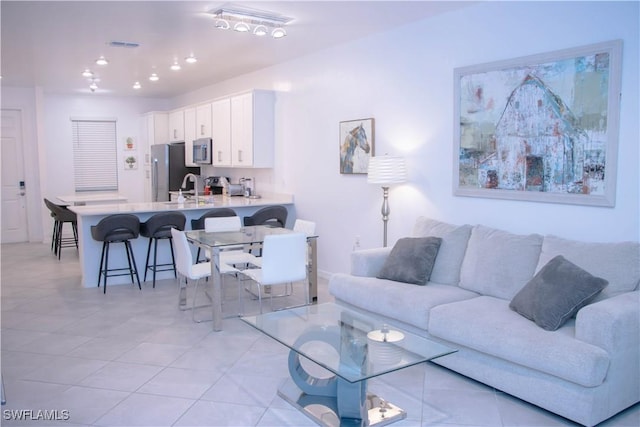 living area with recessed lighting and visible vents