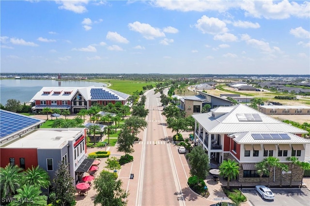 birds eye view of property with a water view and a residential view