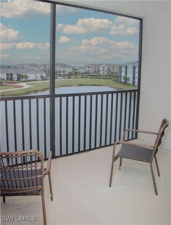 balcony featuring a water view