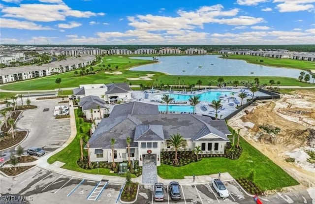 bird's eye view with a water view and golf course view