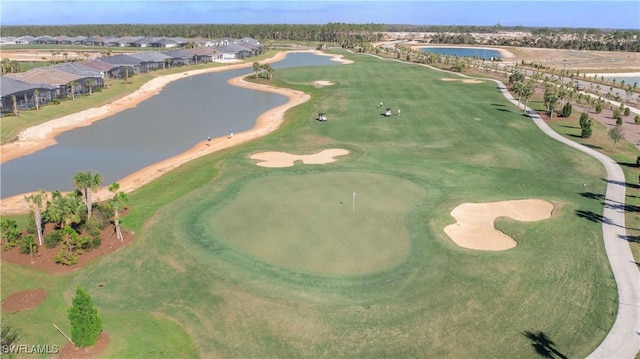 drone / aerial view featuring a water view and view of golf course