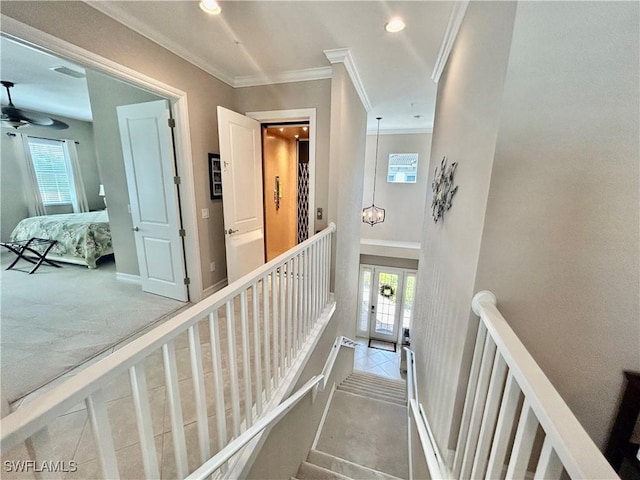 corridor featuring ornamental molding, recessed lighting, an upstairs landing, and a healthy amount of sunlight