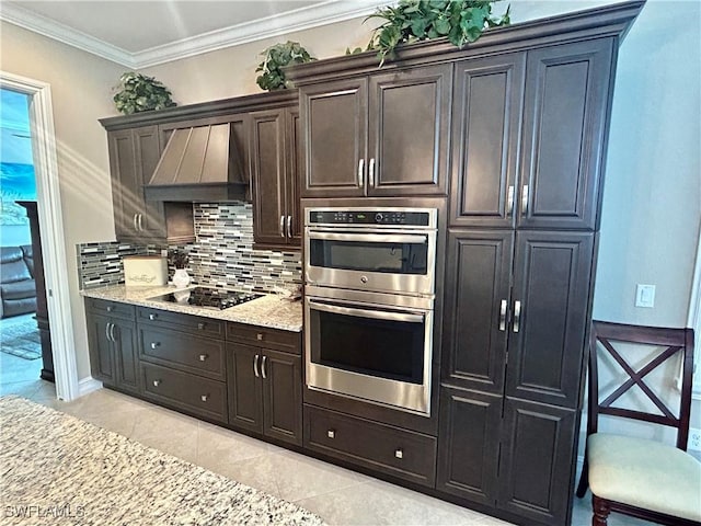 kitchen with double oven, black electric cooktop, ornamental molding, custom exhaust hood, and tasteful backsplash