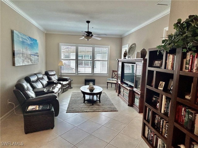 living room featuring crown molding, light tile patterned floors, visible vents, a ceiling fan, and baseboards