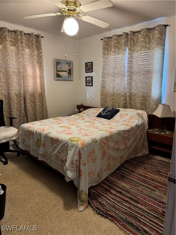 bedroom featuring ceiling fan