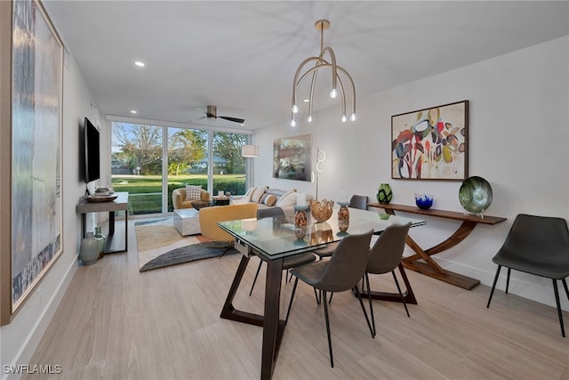 dining space featuring recessed lighting, a ceiling fan, baseboards, light wood-type flooring, and expansive windows