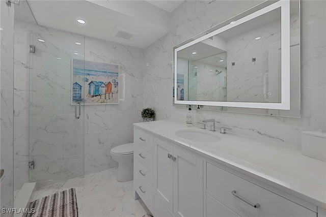 bathroom with toilet, vanity, tile walls, marble finish floor, and a marble finish shower