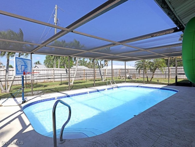 view of swimming pool featuring a lanai, a patio area, a fenced backyard, and a fenced in pool