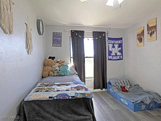 bedroom featuring wood finished floors