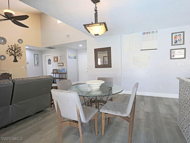 dining room with visible vents, ceiling fan, baseboards, and wood finished floors