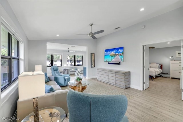 living area with lofted ceiling, recessed lighting, visible vents, baseboards, and light wood-type flooring