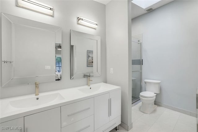 full bath featuring a sink, a shower stall, and toilet