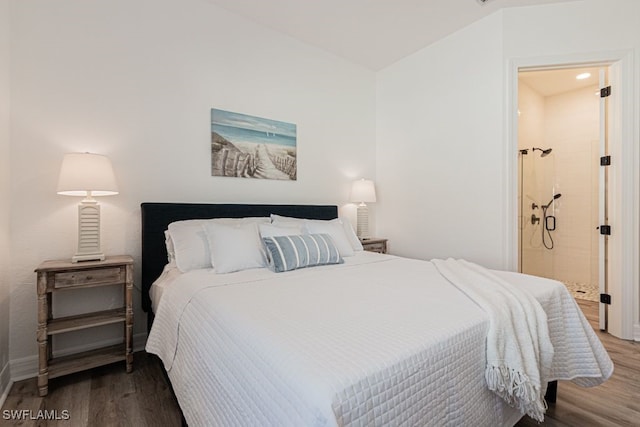 bedroom featuring vaulted ceiling and wood finished floors