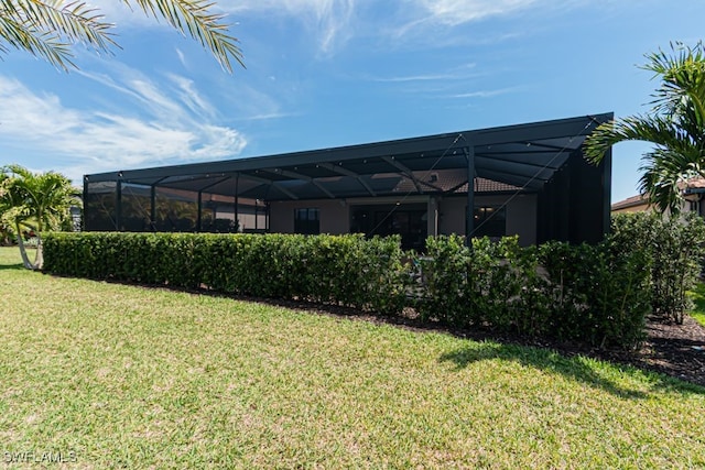 view of yard with glass enclosure