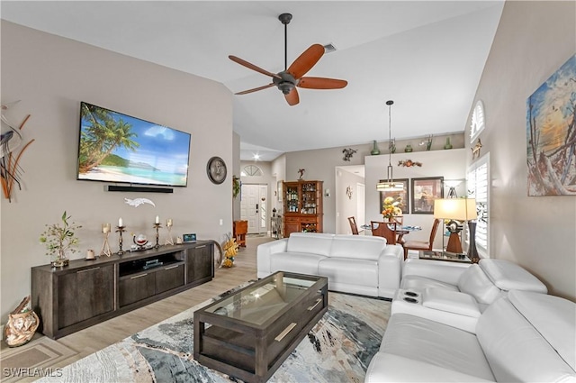 living room featuring high vaulted ceiling, visible vents, ceiling fan, and wood finished floors