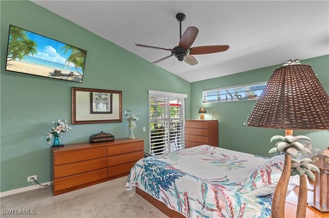 bedroom with lofted ceiling, carpet flooring, ceiling fan, and baseboards