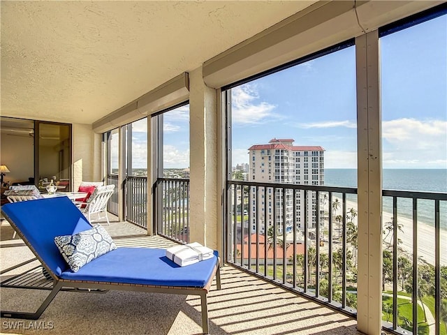 balcony featuring a water view