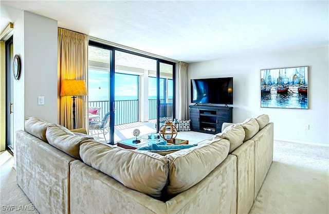 living room with carpet floors, expansive windows, and baseboards