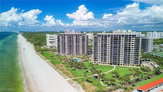 aerial view with a view of city, a water view, and a beach view