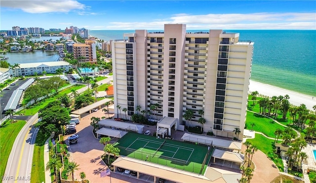 view of property with a water view and a view of city