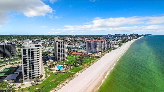 aerial view featuring a water view, a city view, and a view of the beach