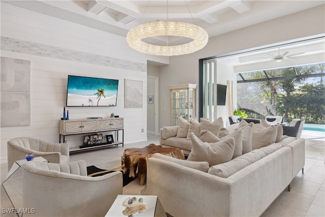 tiled living area featuring wood walls, coffered ceiling, a sunroom, a ceiling fan, and beamed ceiling