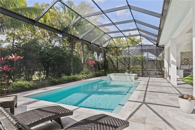 view of pool with a pool with connected hot tub and a patio