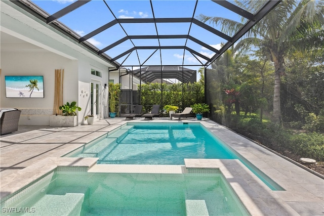 view of pool featuring a patio and a pool with connected hot tub