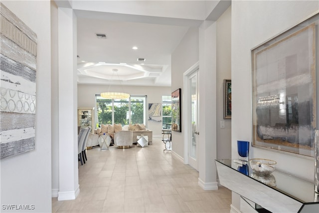 corridor featuring visible vents, baseboards, and recessed lighting