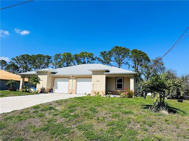 view of front of home with a garage, concrete driveway, a front yard, and stucco siding