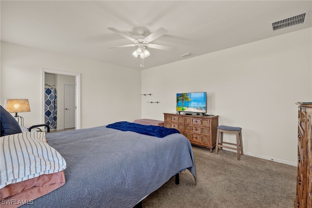 carpeted bedroom with visible vents, ceiling fan, and baseboards