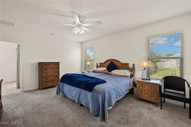 bedroom featuring carpet floors, baseboards, and a ceiling fan